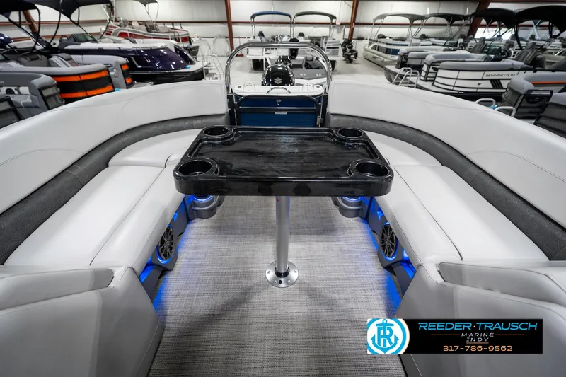 Slide: The Image of 2020 Avalon 2485 boat interior with seating and table, showcased at Reeder-Trausch Marine. - 27