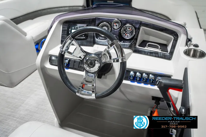 Slide: The Image of 2020 Avalon 2485 boat dashboard with steering wheel and control panel. - 30