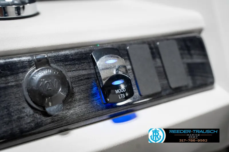 Slide: The Image of Control panel of a 2020 Avalon 2485 boat with mood lighting switch. - 33