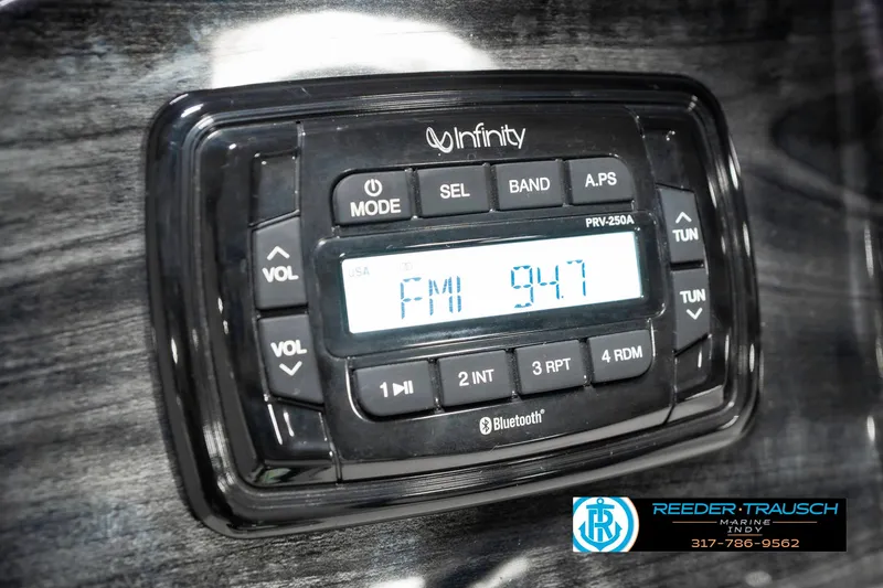 Slide: The Image of Infinity stereo system in a 2020 Avalon 2485, displaying FM 94.7 frequency. - 35