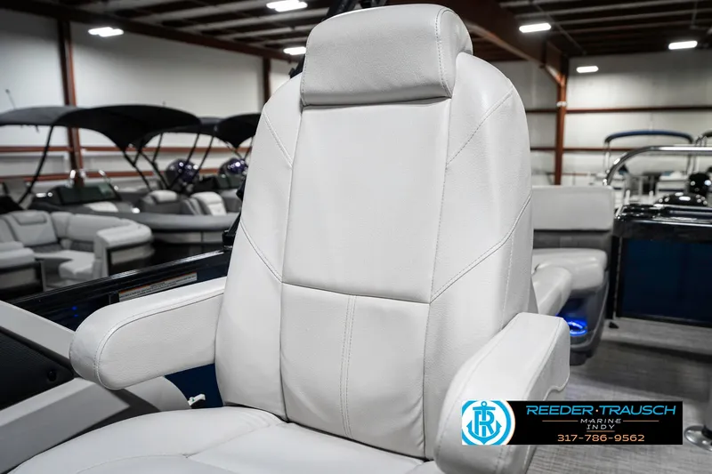 Slide: The Image of Luxurious white captain's chair on 2020 Avalon 2485 boat, showroom setting. - 40