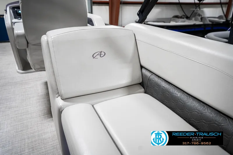 Slide: The Image of 2020 Avalon 2485 boat interior with luxurious white seating and logo detail. - 42