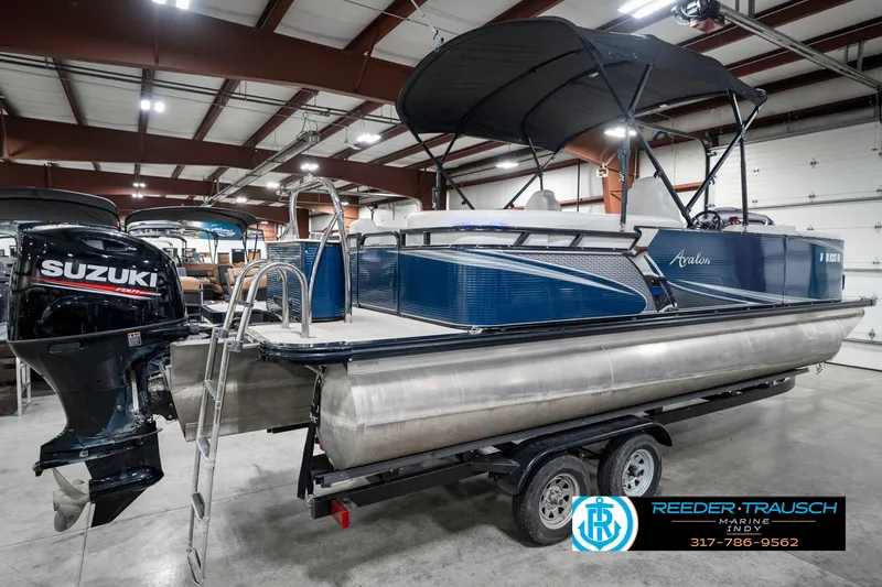 Slide: The Image of 2020 Avalon 2485 pontoon boat with Suzuki outboard motor in indoor showroom. - 8