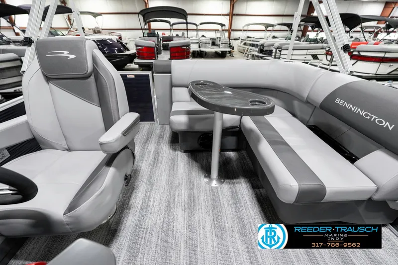 Slide: The Image of Interior of 2025 Bennington 18 SLJ pontoon boat with gray seating and table. - 17