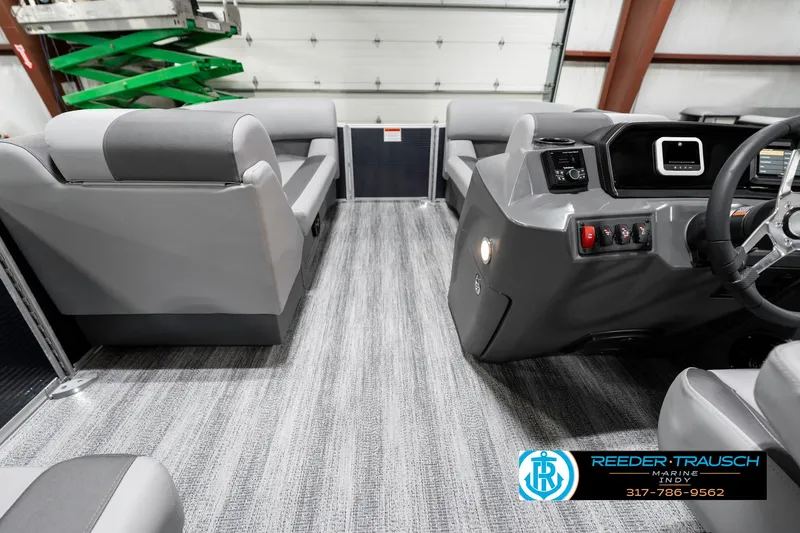 Slide: The Image of 2025 Bennington 18 SLJ pontoon boat interior with modern seating and sleek dashboard. - 20