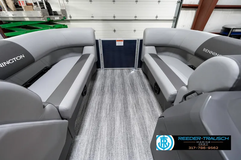 Slide: The Image of 2025 Bennington 18 SLJ boat interior with gray seating and textured flooring. - 21