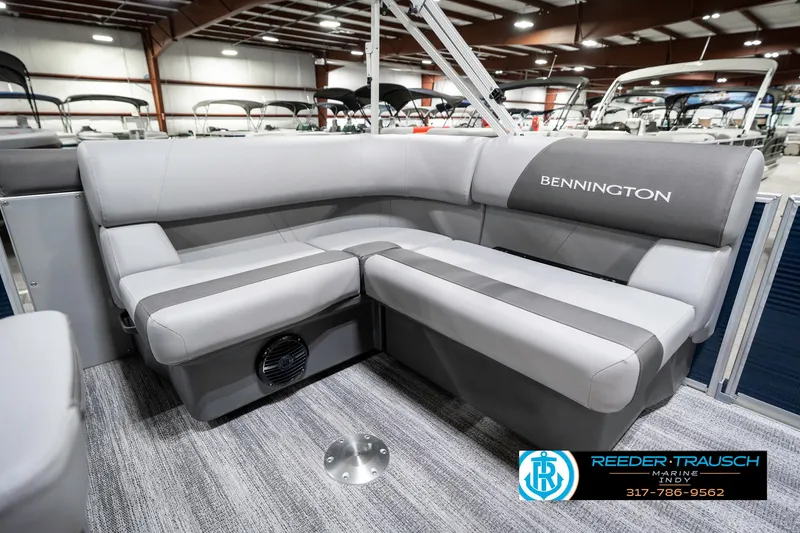 Slide: The Image of 2025 Bennington 18 SLJ pontoon boat interior with gray seating in showroom. - 26