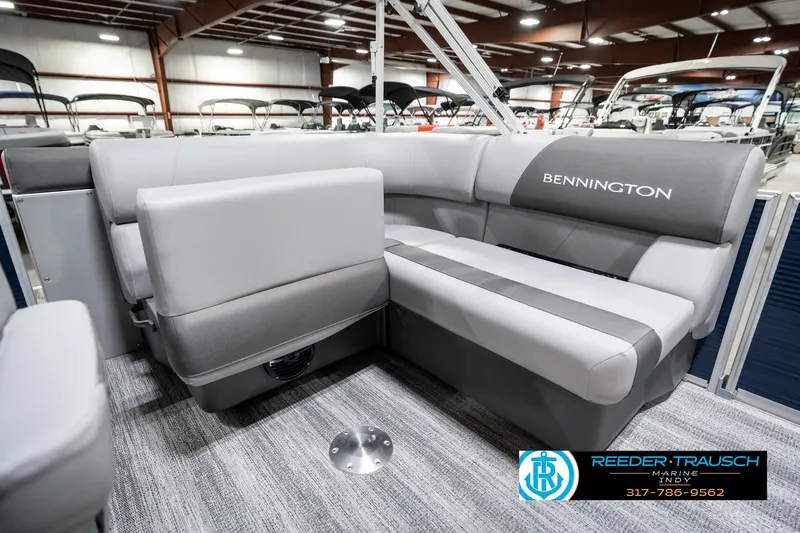 Slide: The Image of 2025 Bennington 18 SLJ pontoon boat interior with gray seating in showroom. - 27