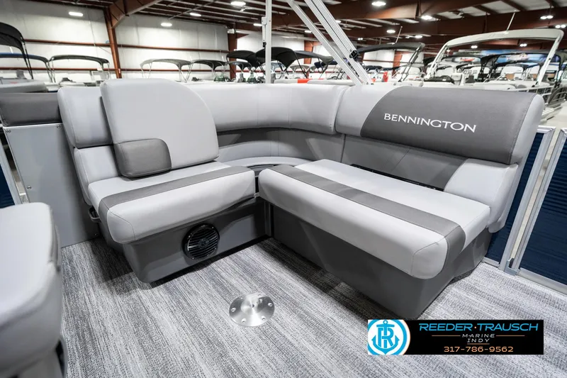 Slide: The Image of 2025 Bennington 18 SLJ pontoon boat interior with gray seating in showroom. - 29