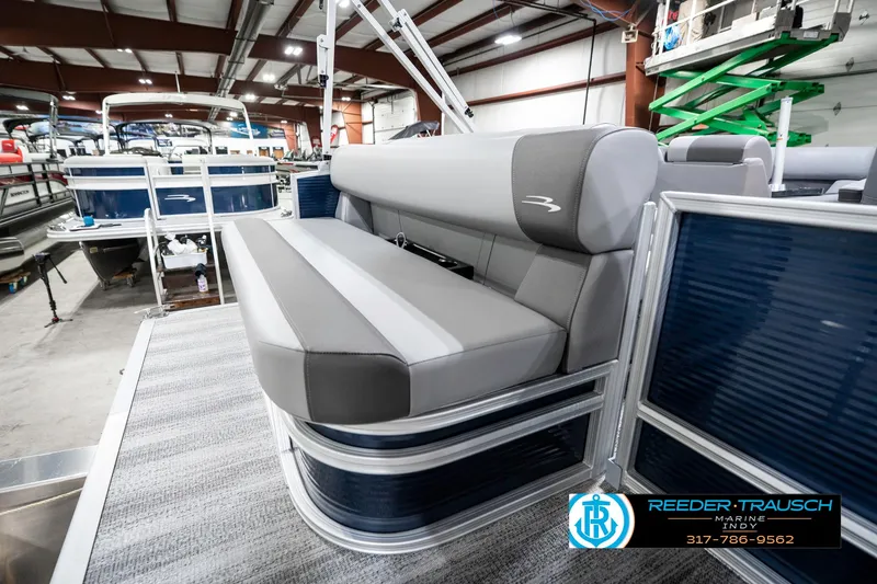 Slide: The Image of 2025 Bennington 18 SLJ pontoon boat interior with gray seating in showroom. - 30