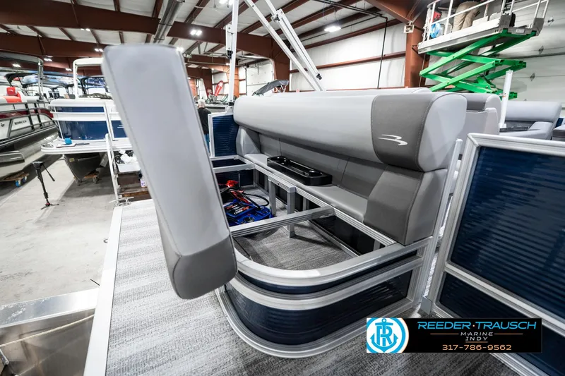 Slide: The Image of 2025 Bennington 18 SLJ pontoon boat interior with gray seating in a showroom. - 31