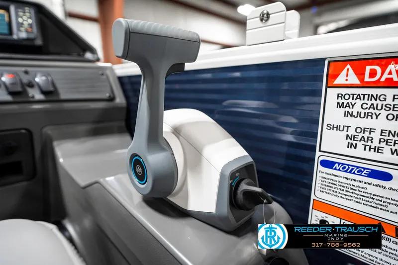 Slide: The Image of Throttle control of 2025 Bennington 18 SLJ boat, featuring safety warnings and branding. - 40