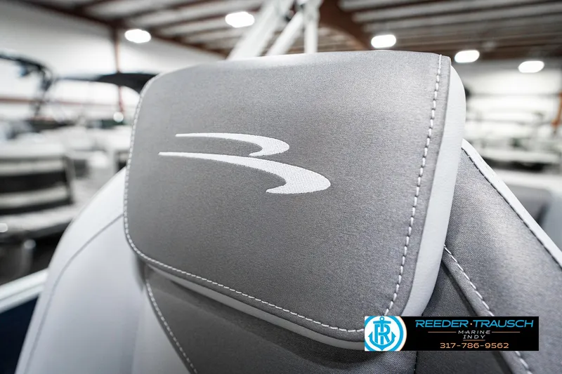 Slide: The Image of 2025 Bennington 18 SLJ boat seat with logo in showroom setting. - 42