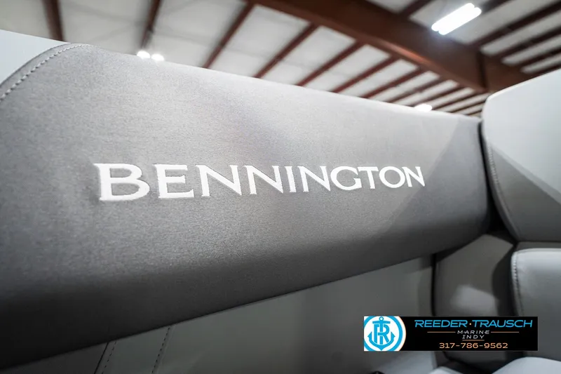 Slide: The Image of 2025 Bennington 18 SLJ boat seat with logo in showroom setting. - 43