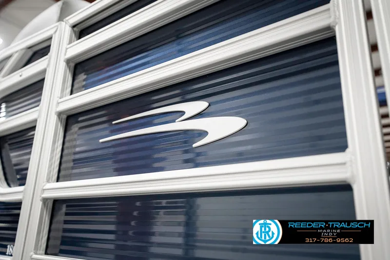 Slide: The Image of 2025 Bennington 18 SLJ boat with sleek design and logo detail. - 47