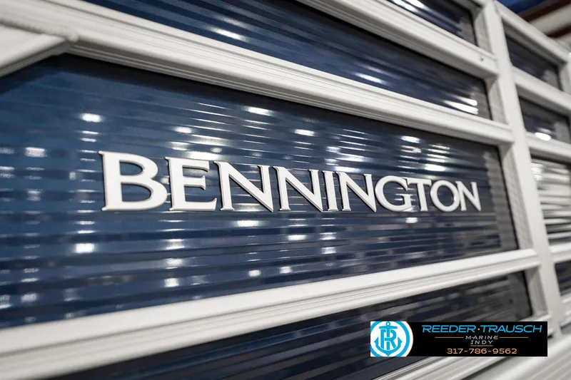 Slide: The Image of 2025 Bennington 18 SLJ boat logo with blue and white detailing. - 48