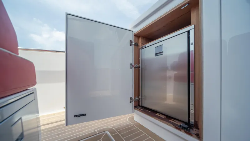 Slide: The Image of Open storage compartment on 2023 Pardo Yachts 38, showcasing sleek interior design. - 11