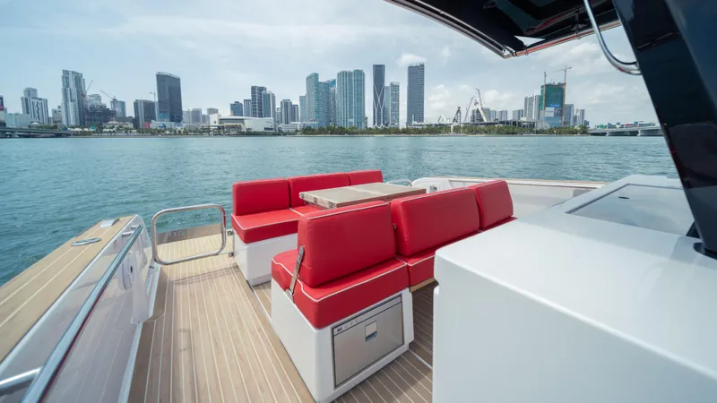 Slide: The Image of 2023 Pardo Yachts 38 with red seating, city skyline view. - 14