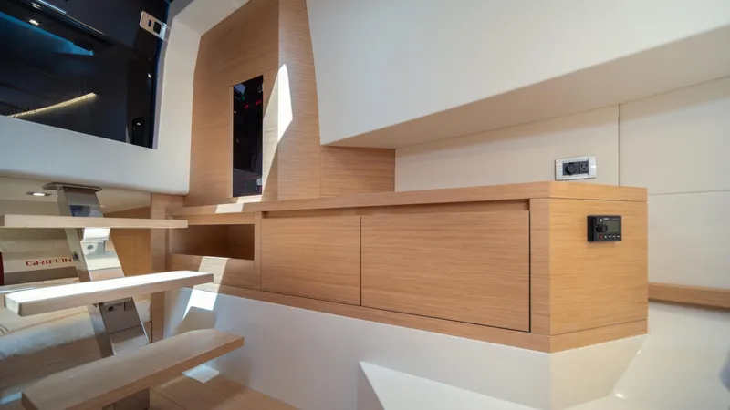 Slide: The Image of Interior of 2023 Pardo Yachts 38, featuring sleek wooden cabinetry and modern design elements. - 31