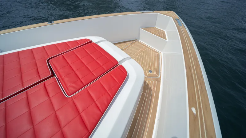 Slide: The Image of Pardo Yachts 38 (2023) with red cushioned seating and teak deck. - 41
