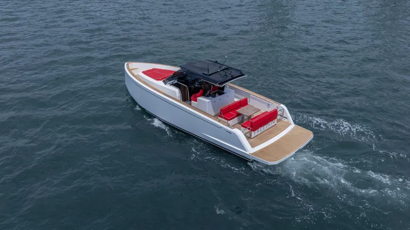 Slide: The Image of 2023 Pardo Yachts 38 cruising on open water, featuring sleek design and red seating. - 45