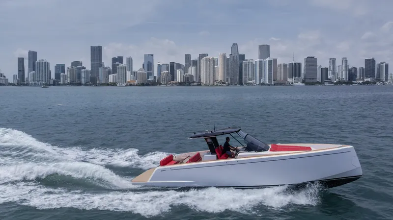Slide: The Image of 2023 Pardo Yachts 38 cruising near a city skyline on a sunny day. - 46