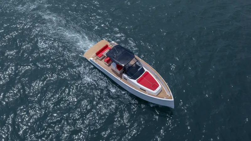 Slide: The Image of 2023 Pardo Yachts 38 cruising on open water, featuring sleek design and red accents. - 48