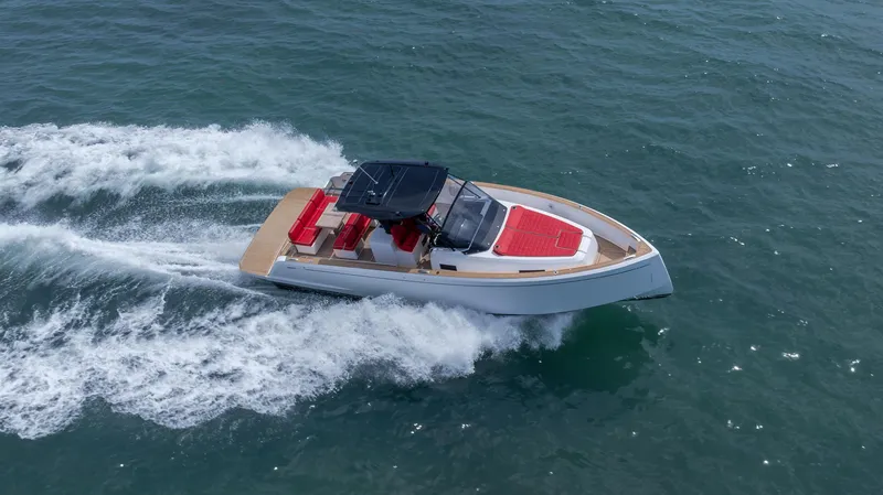 Slide: The Image of 2023 Pardo Yachts 38 cruising on open water, showcasing sleek design and vibrant red accents. - 49