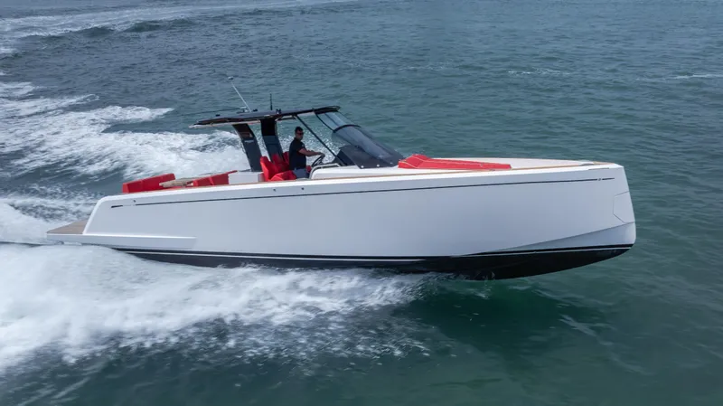 The Image of 2023 Pardo Yachts 38 cruising on open water, sleek design with red seating. - 1