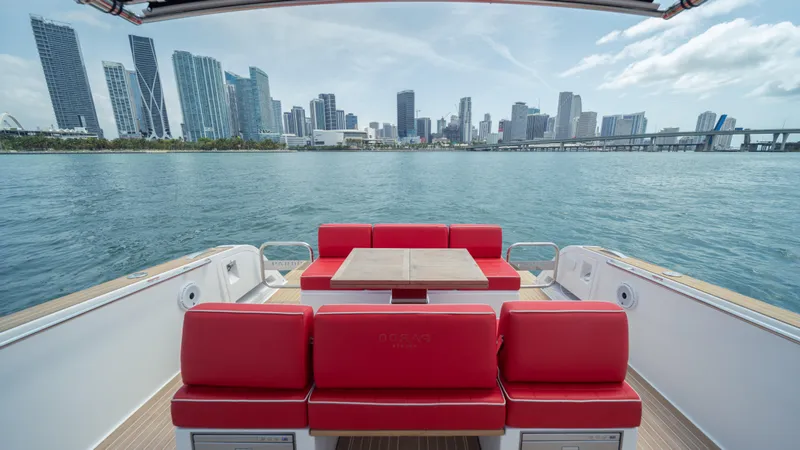 Slide: The Image of 2023 Pardo Yachts 38 with red seating, city skyline view. - 13