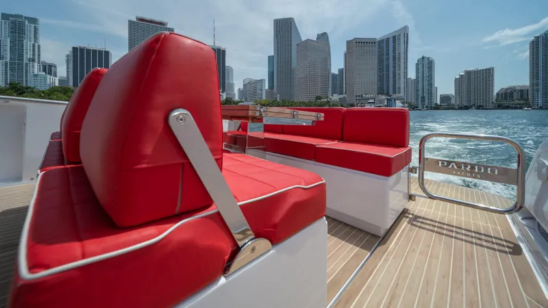 Slide: The Image of 2023 Pardo Yachts 38 with red seating, city skyline in background. - 20