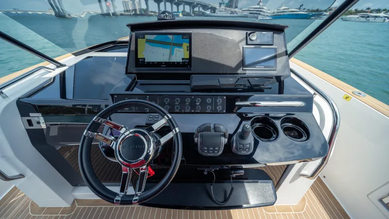Slide: The Image of Helm of 2023 Pardo Yachts 38 with navigation display and controls. - 28
