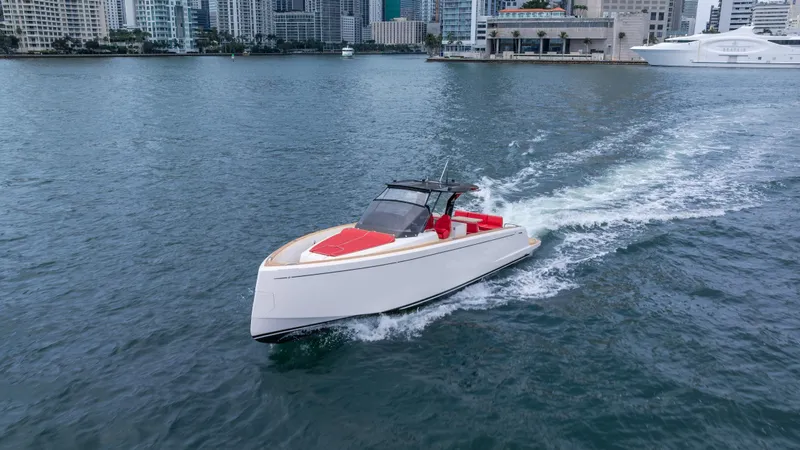 Slide: The Image of 2023 Pardo Yachts 38 cruising in a city harbor, showcasing sleek design and luxury. - 3