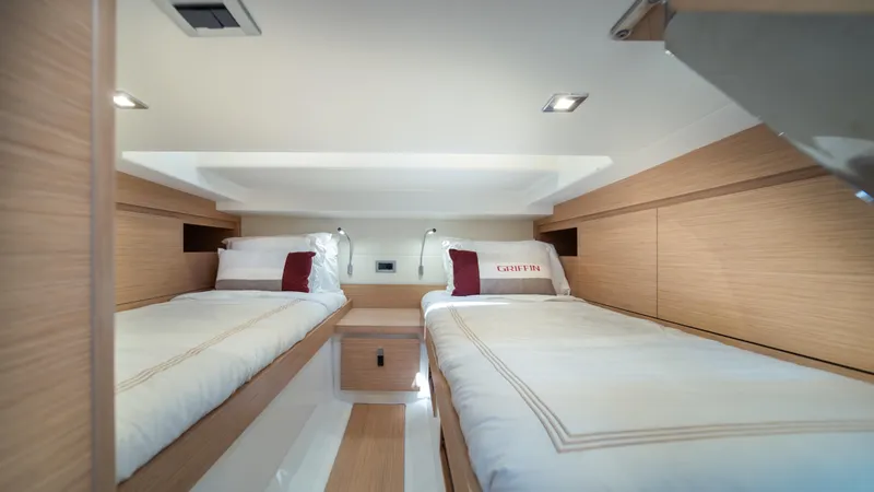 Slide: The Image of Interior of 2023 Pardo Yachts 38 featuring twin beds in a modern cabin. - 38