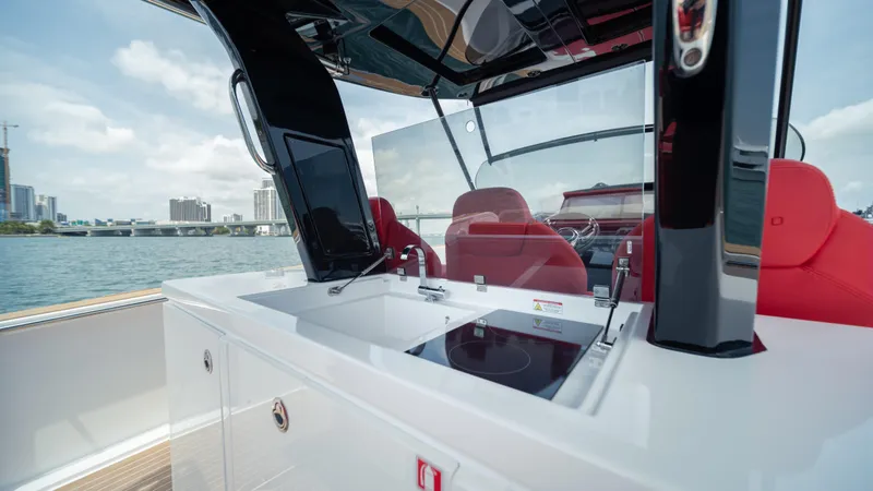 Slide: The Image of 2023 Pardo Yachts 38 with sleek design, featuring modern cockpit and luxurious red seating. - 39