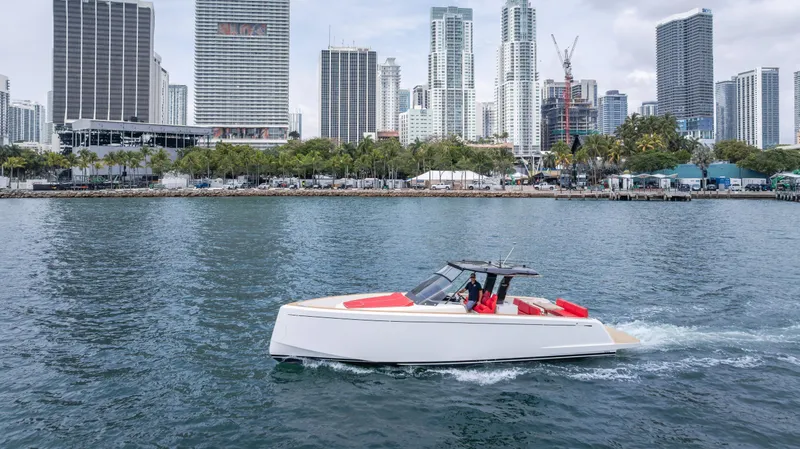 Slide: The Image of 2023 Pardo Yachts 38 cruising in urban waterfront with city skyline backdrop. - 6