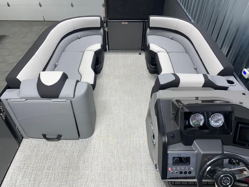 Slide: The Image of 2025 Avalon Catalina 2385 QL Tritoon interior with sleek seating and modern dashboard. - 10