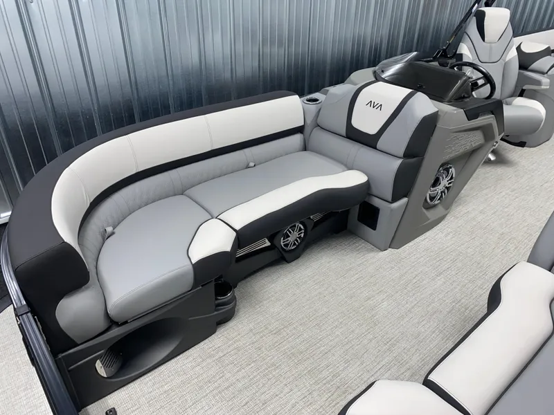Slide: The Image of 2025 Avalon Catalina 2385 QL Tritoon interior with sleek, modern seating and steering console. - 12