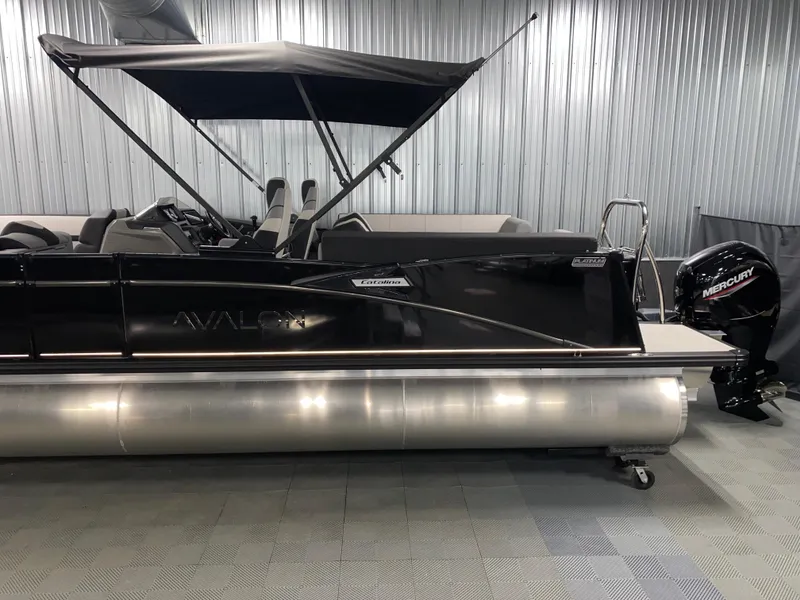 Slide: The Image of 2025 Avalon Catalina 2385 QL Tritoon with Mercury engine in a showroom. - 17