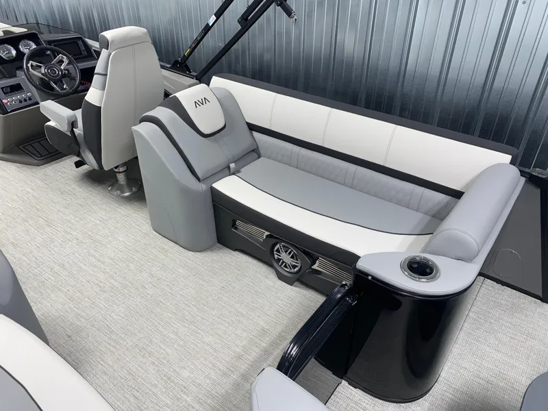 Slide: The Image of 2025 Avalon Catalina 2385 QL Tritoon interior with modern seating and steering console. - 3