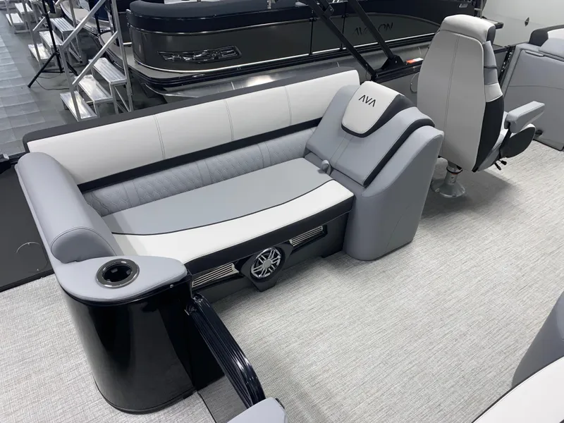 Slide: The Image of 2025 Avalon Catalina 2385 QL Tritoon interior with sleek seating and modern design. - 4