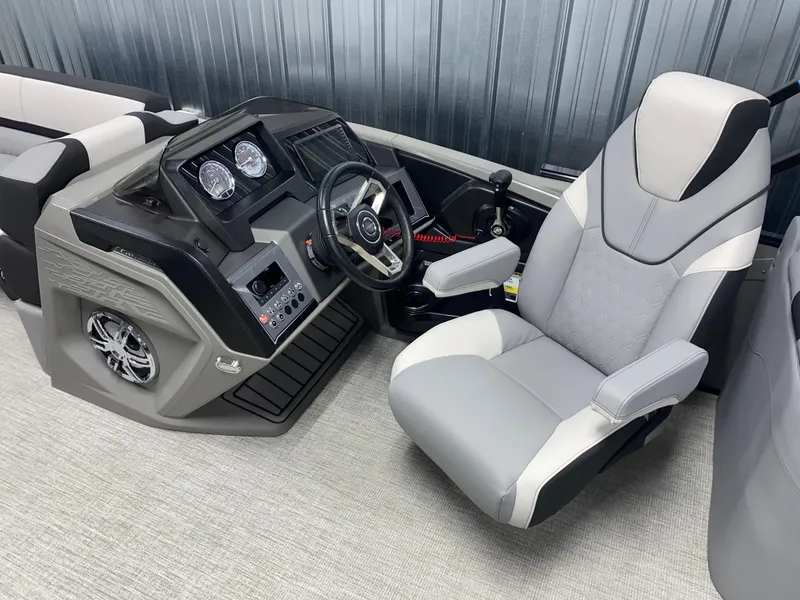 Slide: The Image of 2025 Avalon Catalina 2385 QL Tritoon helm with modern controls and comfortable captain's chair. - 5
