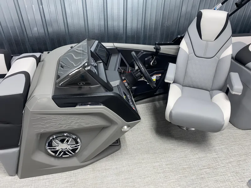 Slide: The Image of 2025 Avalon Catalina 2385 QL Tritoon helm with modern controls and comfortable captain's chair. - 6
