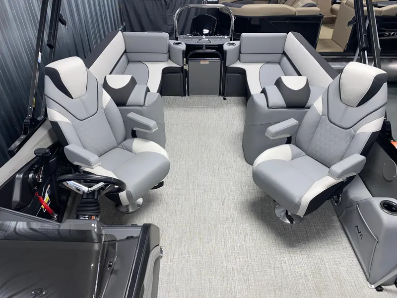 Slide: The Image of 2025 Avalon Catalina 2385 QL Tritoon interior with luxurious seating and modern design. - 9
