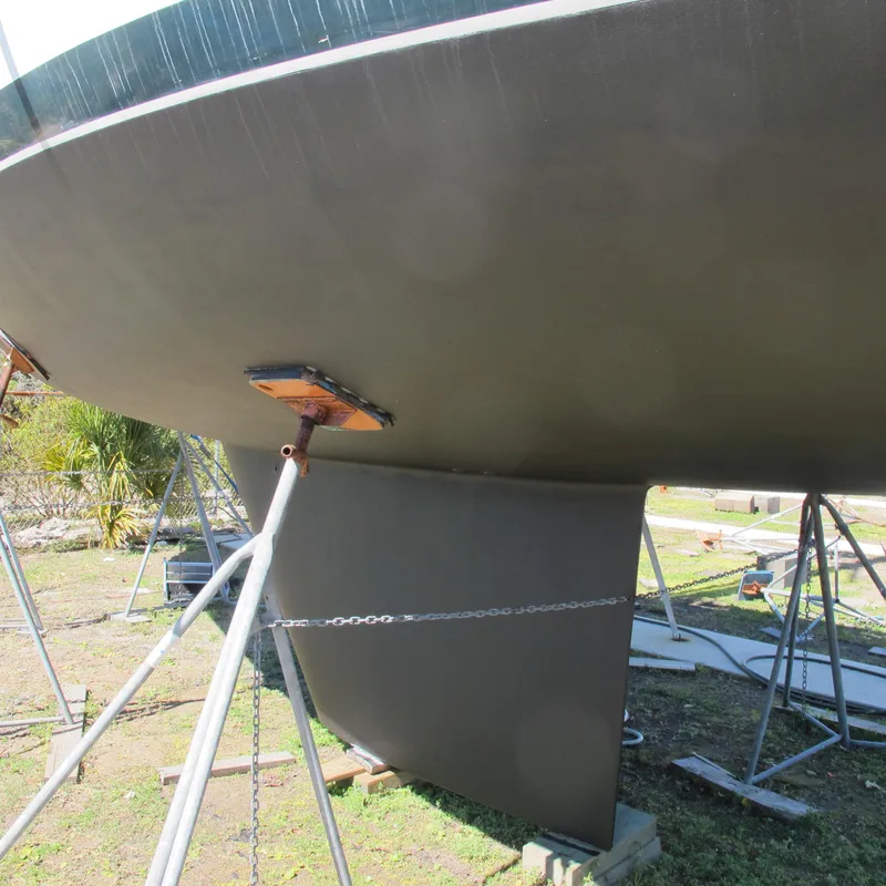 Slide: The Image of Bottom view of a 1999 Catalina 42 MkII sailboat on stands, showing keel and hull. - 14