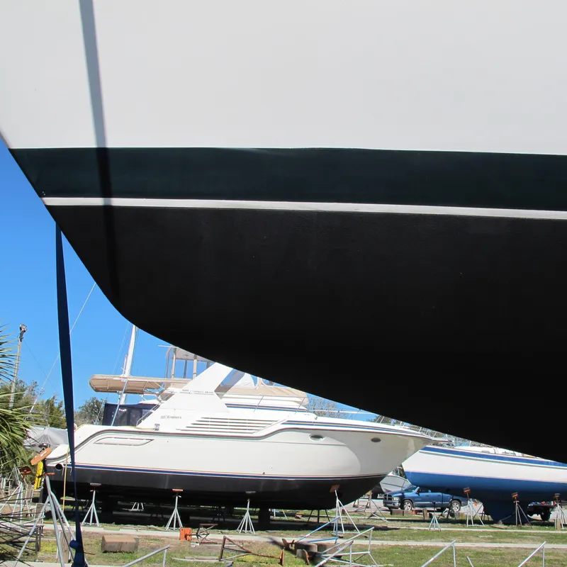Slide: The Image of Sailboat hull of a 1999 Catalina 42 MkII in a boatyard. - 16