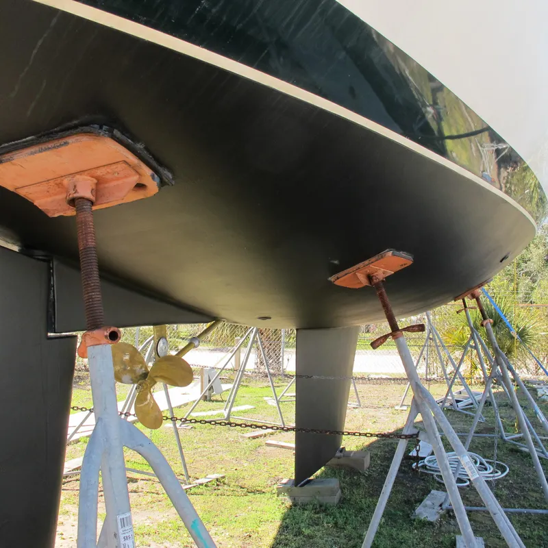 Slide: The Image of 1999 Catalina 42 MkII sailboat hull on stands, showing propeller and keel. - 17
