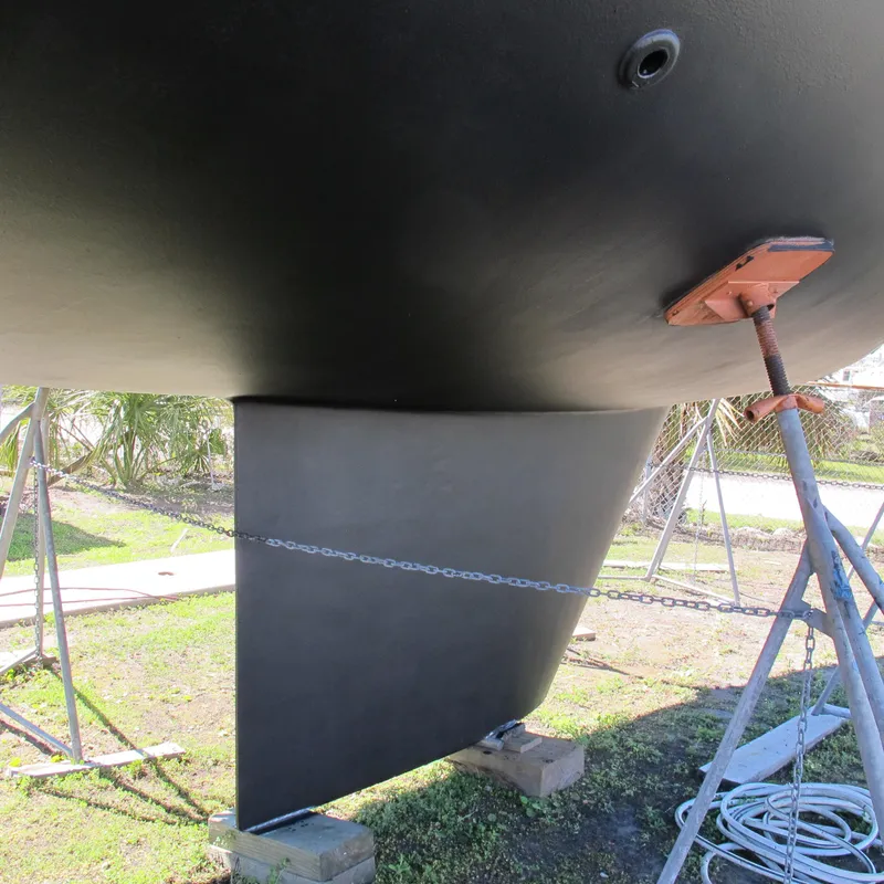 Slide: The Image of Bottom view of a 1999 Catalina 42 MkII sailboat on stands, showing keel and hull. - 18