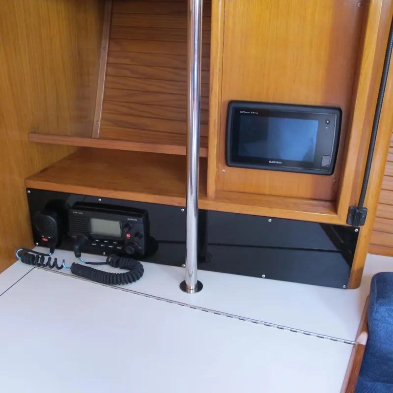 Slide: The Image of Interior of 1999 Catalina 42 MkII yacht with navigation equipment and wooden cabinetry. - 22