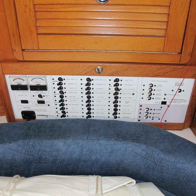 Slide: The Image of Electrical panel of a 1999 Catalina 42 MkII sailboat with switches and gauges. - 23